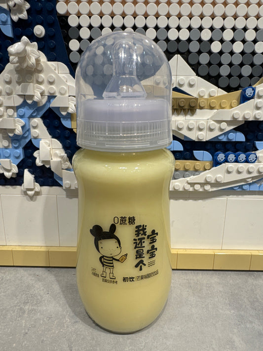 Boisson laitière biberon à la mangue