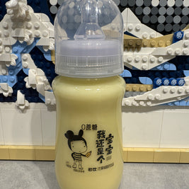 Boisson laitière biberon à la mangue